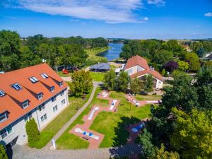 an aerial view of a house with a large yard at Bernstein Acamed Resort in Nienburg