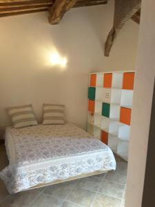 a bedroom with a bed in a room at La Steccaia in Riparbella