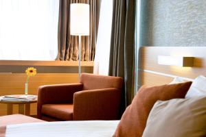 Säng eller sängar i ett rum på Hotel Tunali