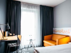 Postel nebo postele na pokoji v ubytování Q Hotel Kraków