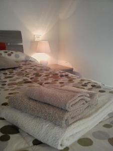 A bed or beds in a room at La Graziosa Dépendance