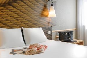 מיטה או מיטות בחדר ב-ibis Hotel Berlin Mitte