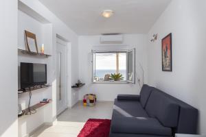 Телевизор и/или развлекательный центр в Apartments Luna