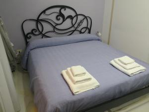 Katil atau katil-katil dalam bilik di B&B LA CASA DI GIORGIA DI PELLICANO' FRANCESCA