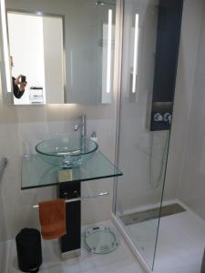 a bathroom with a glass sink and a shower at Appartement Le Chantilly in Cagnes-sur-Mer +19 photos