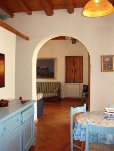 a kitchen and living room with a table and a couch at Villa Eoliana in Porto San Giorgio +34 photos