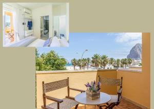 a room with a balcony with a table and chairs at Suite Faro 33 in San Vito lo Capo