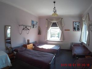 Postel nebo postele na pokoji v ubytování Mikulas Guest House