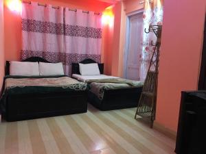 Letto o letti in una camera di Pashupati Darshan Hotel