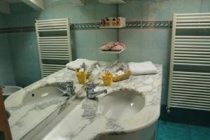 Koupelna v ubytování Residence Zecchini + 29 fotografií