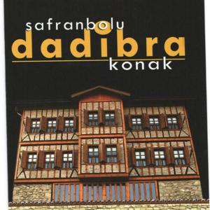 a book with a drawing of a building at Dadibra Konak Hotel in Safranbolu