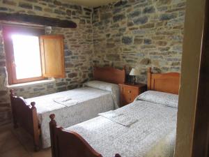 Postel nebo postele na pokoji v ubytování Hotel rural Valtarranz