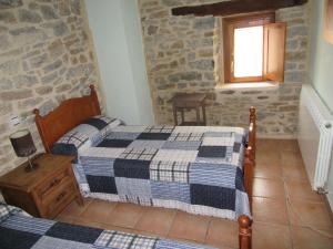 Postel nebo postele na pokoji v ubytování Hotel rural Valtarranz