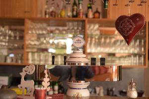 a bar with a counter with a heart ornament on the top at Landhotel Röfleuten in Pfronten