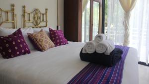A bed or beds in a room at Casa Ambar Tulum - Great Location