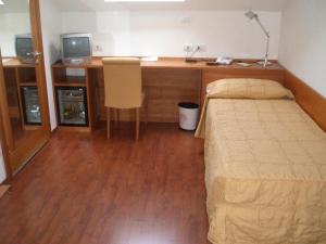 Łóżko lub łóżka w pokoju w obiekcie Hotel Ristorante La Casona