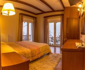 Ένα ή περισσότερα κρεβάτια σε δωμάτιο στο Hotel Steni