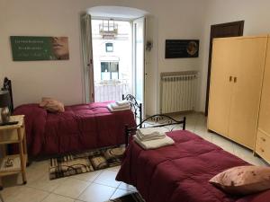 Voodi või voodid majutusasutuse House Corso Mazzini 214 toas