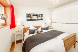 a bedroom with a large bed and a window at Louisa in Oberstdorf