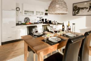 a dining room table with wine glasses on it at Louisa in Oberstdorf +12 photos