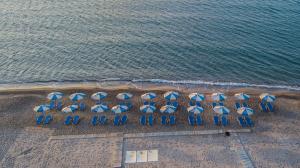 an overhead view of a beach with chairs and umbrellas at Kordistos Hotel in Kefalos