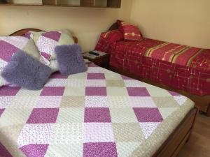 Cama ou camas em um quarto em Hostal Arenas del Mar