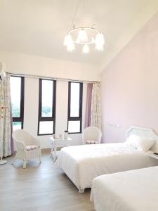 Postel nebo postele na pokoji v ubytování Taroko Formosa Homestay