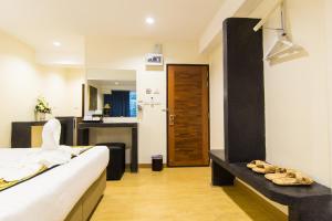 Postel nebo postele na pokoji v ubytování Suan Dok Gate Guesthouse