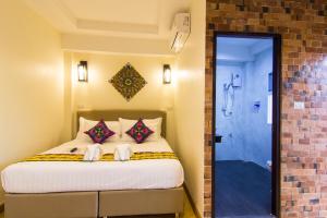 Postel nebo postele na pokoji v ubytování Suan Dok Gate Guesthouse