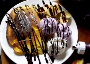 a plate of desserts with chocolate and ice cream at Mind House Bungalow in Nam Theun