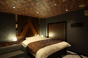 Ένα ή περισσότερα κρεβάτια σε δωμάτιο στο Himeji Park Hotel (Adult Only)
