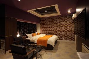Ένα ή περισσότερα κρεβάτια σε δωμάτιο στο Himeji Park Hotel (Adult Only)