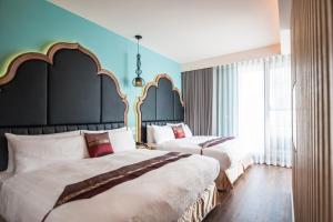 Letto o letti in una camera di Dreamer Boutique Hotel