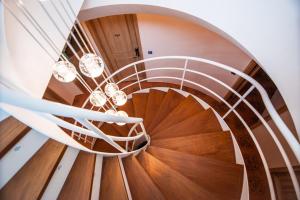 a spiral staircase in a house with wooden floors at Dreamer Boutique Hotel in Nanwan