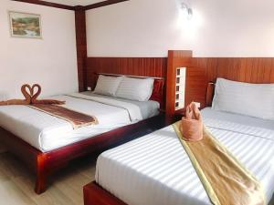 Postel nebo postele na pokoji v ubytování Grand Beach Resort