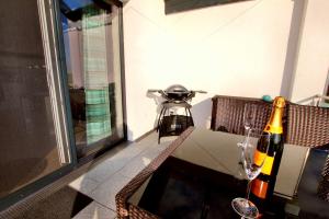 a table with two bottles of wine on it at Villa Grande Fewo Relax We 4 in Göhren-Lebbin