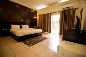 Voodi või voodid majutusasutuse Hotel Palm Beach toas