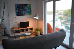 Televízia a/alebo spoločenská miestnosť v ubytovaní Summer House Krištof