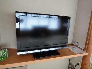 TV a/nebo společenská místnost v ubytování Miyajima Hotel Makoto