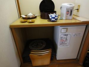 Kuchyň nebo kuchyňský kout v ubytování Miyajima Hotel Makoto
