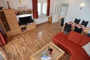 TV a/nebo společenská místnost v ubytování Villa Strandidyll Wohnung 9 + 22 fotografií