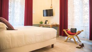 Postel nebo postele na pokoji v ubytování Ripetta Rooms