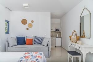 a living room with a couch and a table at Kordistos Hotel in Kefalos