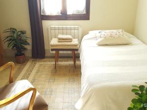 Postel nebo postele na pokoji v ubytování Casa Argentera