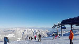 a group of people on a snow covered ski slope at Haus am Sunnfeld in Alpbach