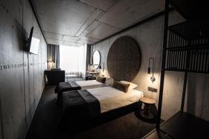 Łóżko lub łóżka w pokoju w obiekcie Hotel Remes