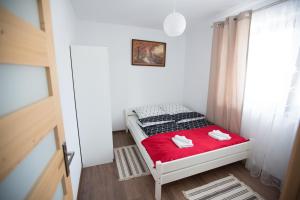 Posteľ alebo postele v izbe v ubytovaní Apartamenty "Zielony Zakątek" Olcza Zakopane