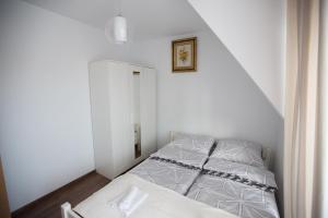 Posteľ alebo postele v izbe v ubytovaní Apartamenty "Zielony Zakątek" Olcza Zakopane