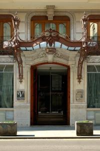 an entrance to a building with a large wooden door at Vincci Palace in Valencia
