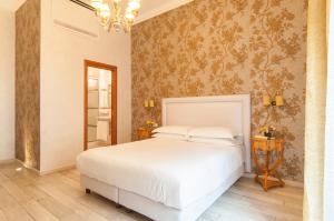Postel nebo postele na pokoji v ubytování Ripetta Rooms